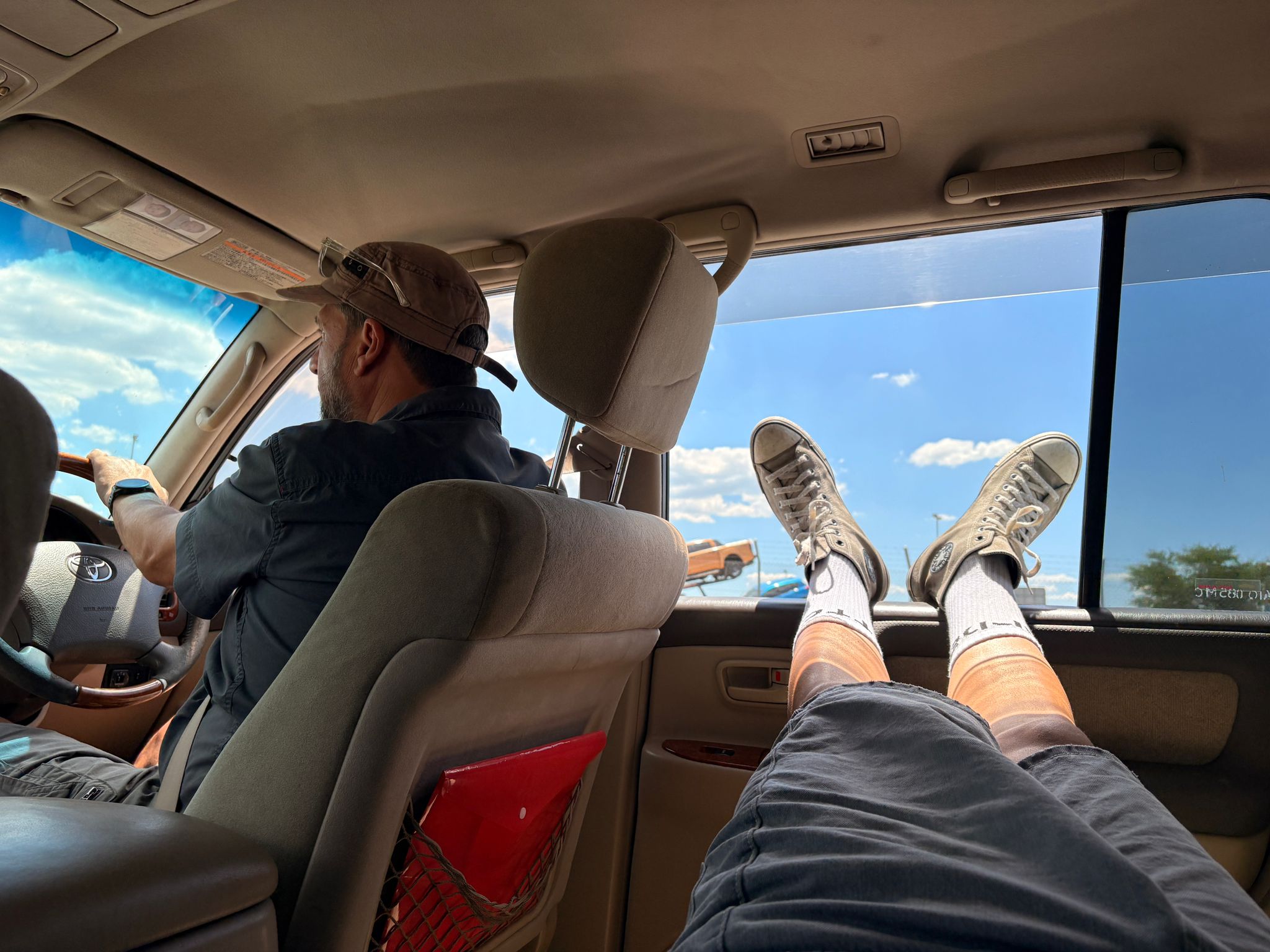 Feet up, dad driving — road trip vibes